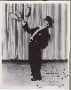  English, Ralph. Juggler, magician, vaudeville performer [1930s-1950s]. He performed his routines on ice skates., Photograph Inscribed and Signed by Ice-Skater Juggler & Magician Ralph English.